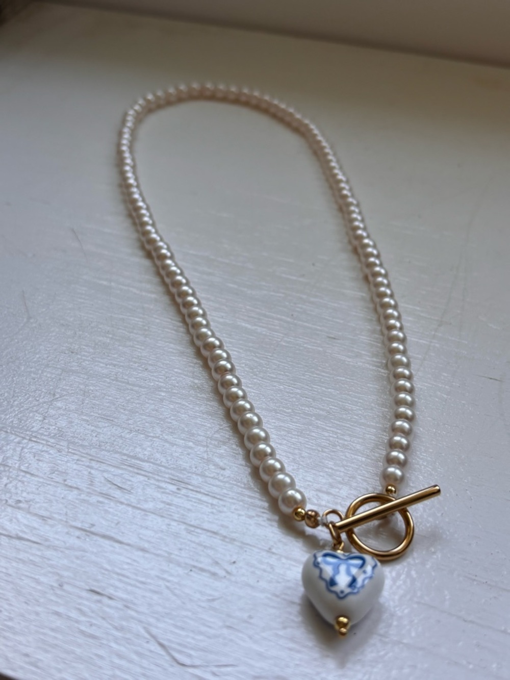 Glass Pearl Necklace with Blue and White Heart Charm - Gold Toggle - Picture 2 of 3